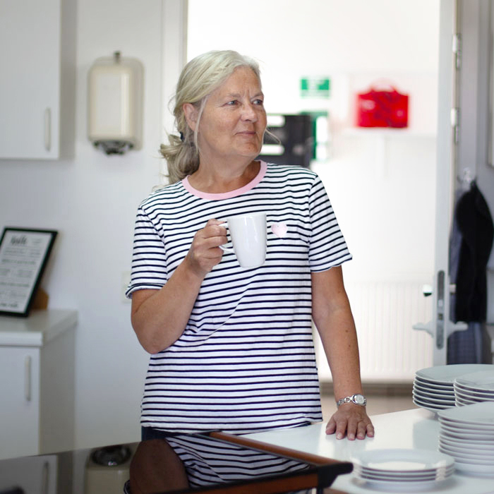 Colleagues at CleanManager chatting during a coffee break.